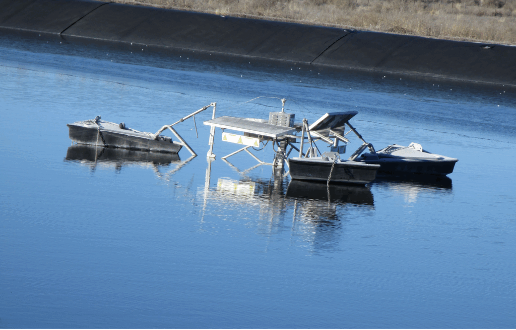 Solar aerator on a treatment lagoon. Image Credit: Tucker Colvin, Southwest Environmental Finance Center.